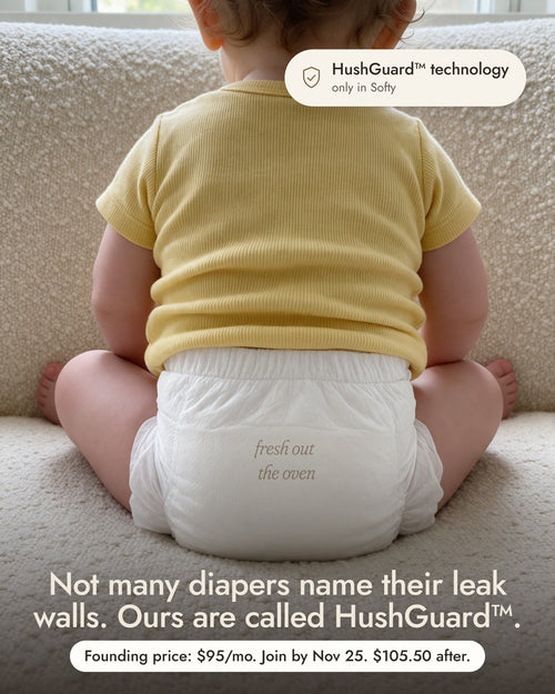 A toddler in a yellow tee sitting on a cream rug, seen from behind, with the HushGuard technology callout