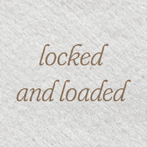 A close-up of the back of a Softy diaper with the phrase locked and loaded