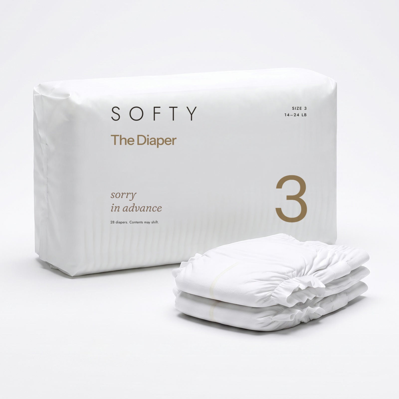 The Diaper pack and three loose diapers on an oat backdrop, the pack and a diaper printed sorry in advance