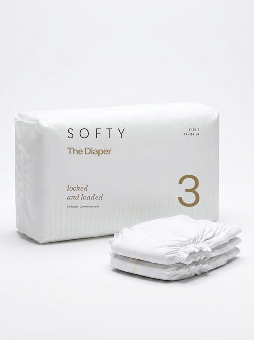 The Diaper pack, printed locked and loaded, beside a stack of three diapers